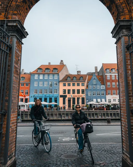 Cyclists framed by an archway, Copenhagen